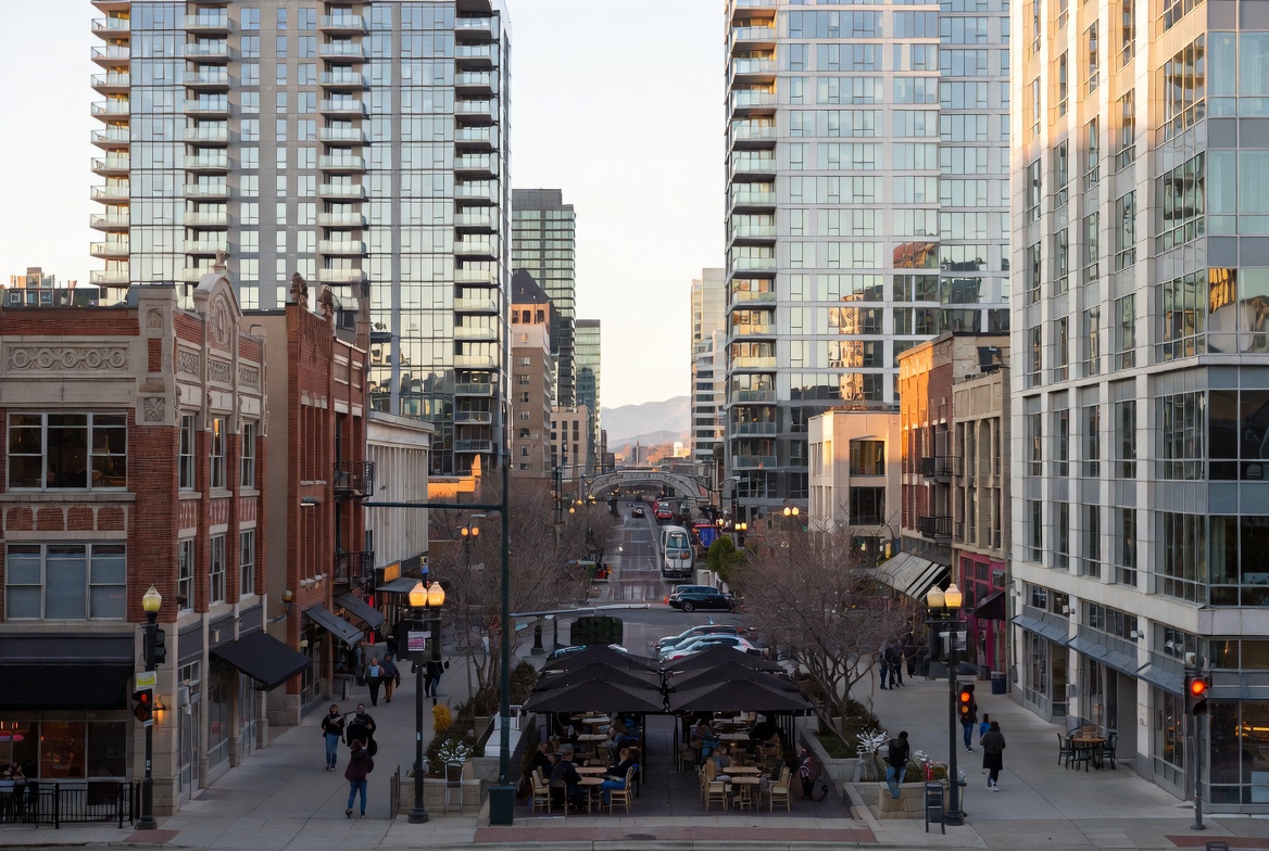 A downtown Salt Lake City street lined with outdoor patio dining