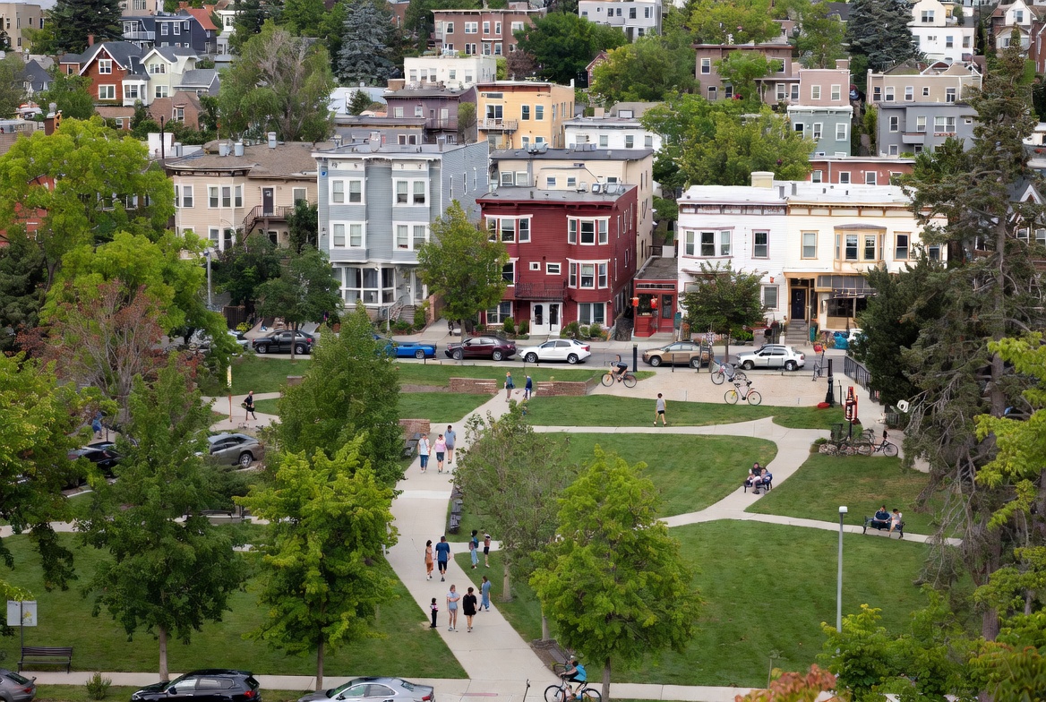 People walking the paths of a Salt Lake City neighborhood park